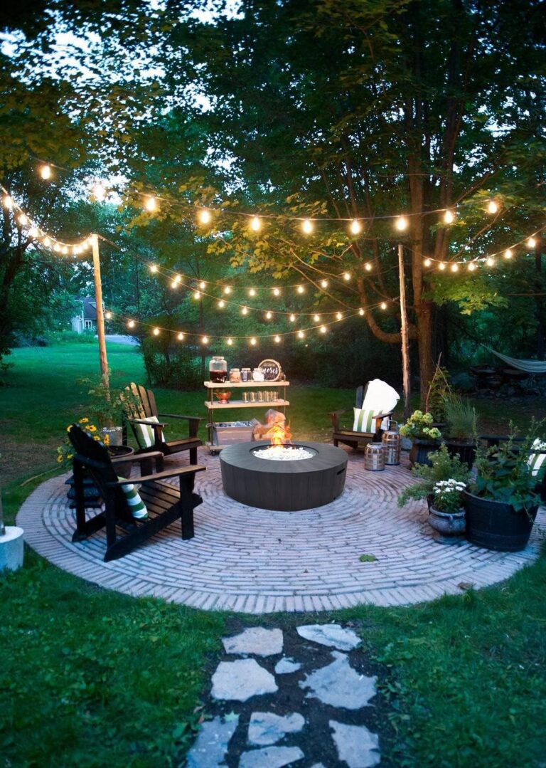 Outdoor patio at night with fire pit